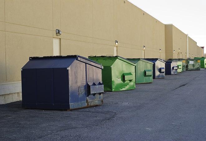 a row of industrial dumpsters at a construction site in Columbus, PA